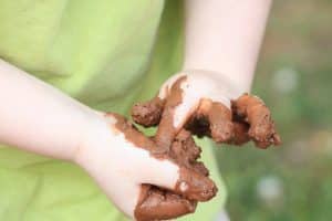 Child's Muddy Clay Hands
